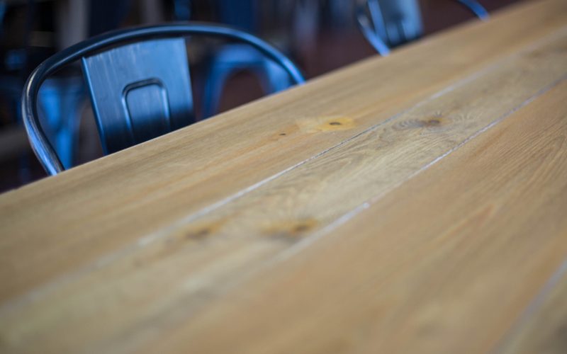 An empty café table with metal chairs